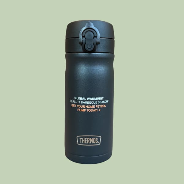Black Thermos bottle with the text "GLOBAL WARMING? I CALL IT BARBECUE SEASON! GET YOUR HOME PETROL PUMP TODAY!"
