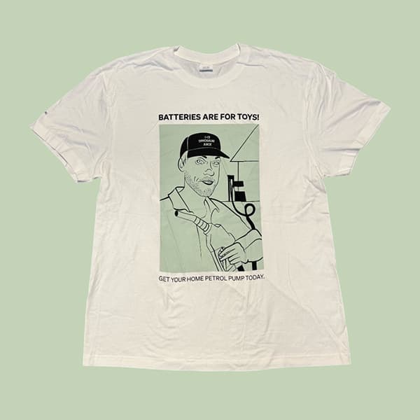 White T-shirt with line drawing of a person wearing a cap and holding a petrol pump, with the text 'BATTERIES ARE FOR TOYS! GET YOUR HOME PETROL PUMP TODAY.'